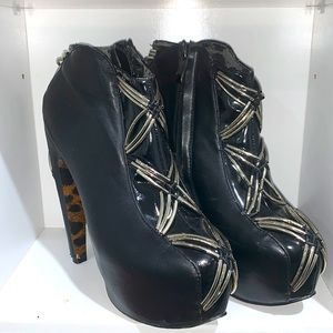 Women’s black and chrome or silver high heel ankle boots